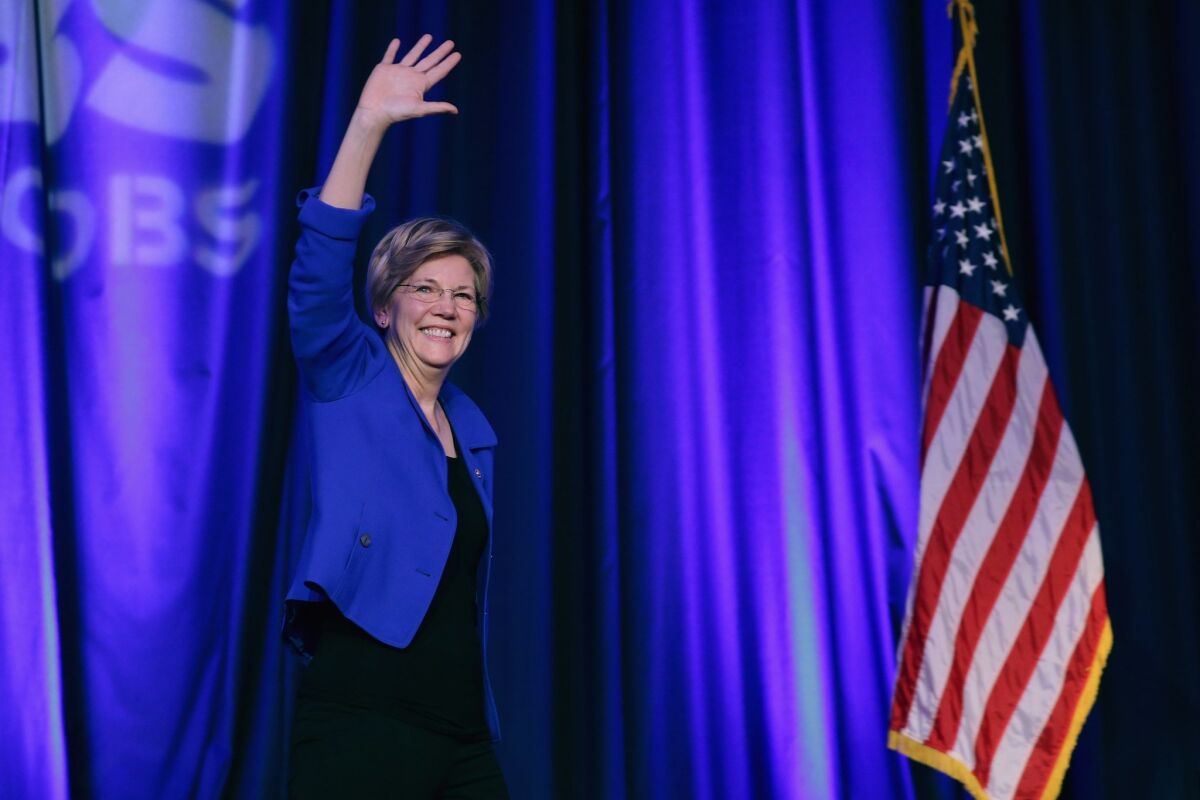 Sen. Elizabeth Warren (D-Mass.) is welcomed to the stage during the Good Jobs Green Jobs National Conference at the Washington Hilton on April 13.
