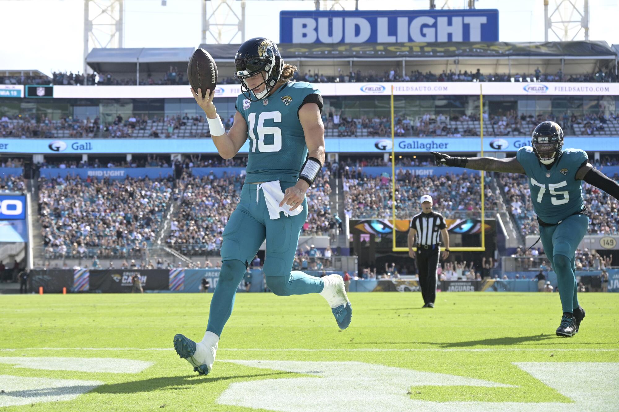 Jacksonville Jaguars quarterback Trevor Lawrence celebrates his 4-yard rushing touchdown.