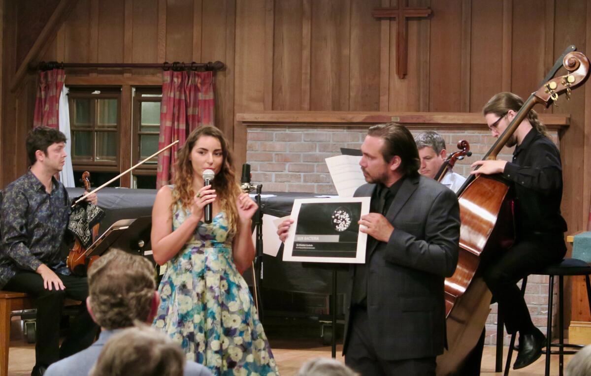 DMICS 2019 Composer Elisabet Curbelo (left) describes her music to the audience and DMICS Director Jordan Kuspa.