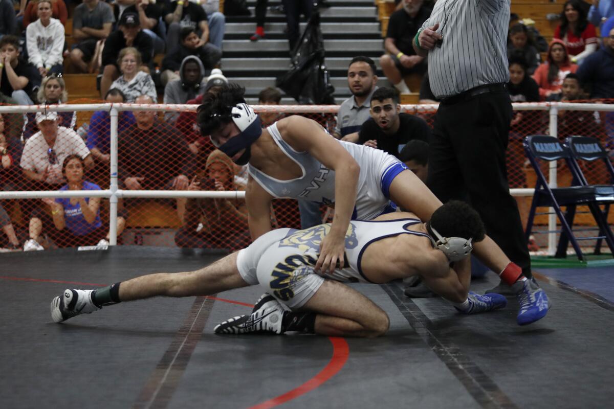 Fountain Valley's Mikey Folch, top, competes in the 120-pound final during the CIF Southern Section Northern Division individual wrestling championships on Saturday at Marina High. Folch won the match.