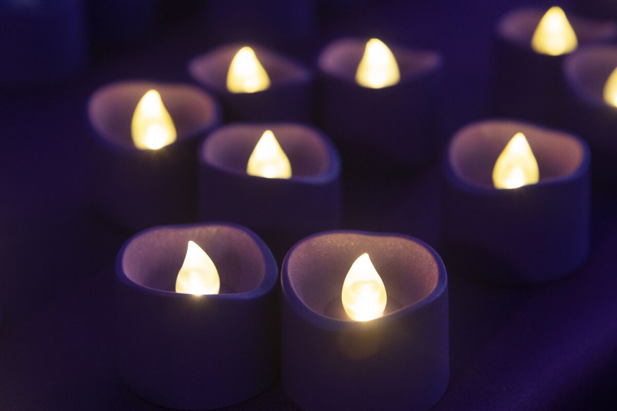 Candles that are part of a violence for domestic violence awareness.