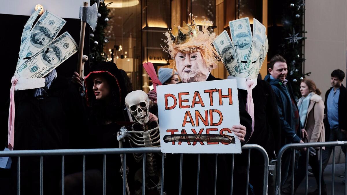 Protesters opposed to the Republican tax bill demonstrate outside Trump Tower in New York on Nov. 21.