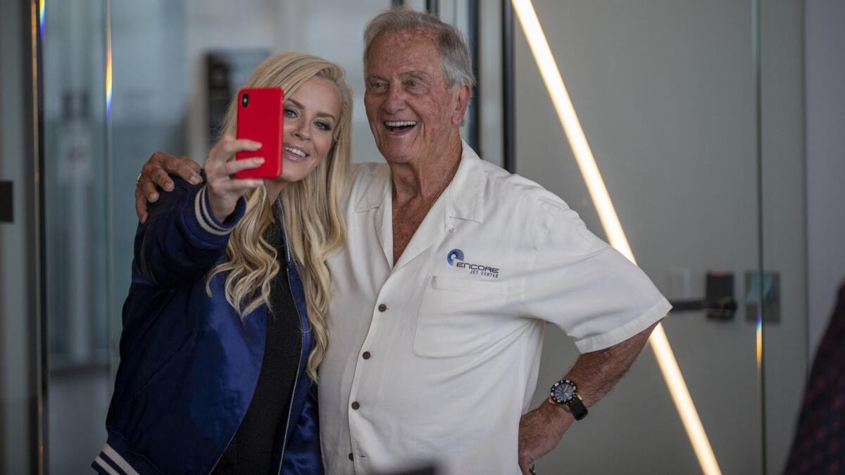 SiriusXM series host Jenny McCarthy grabs a selfie with " '50s on 5" host Pat Boone at SiriusXM satellite radio's new offices in Los Angeles.