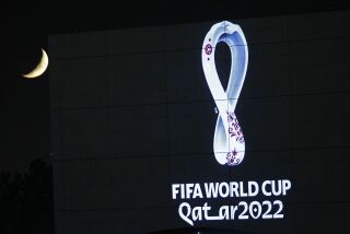 FILE - The 2022 Qatar World Cup logo is projected on the opera house of Algiers, Tuesday Sept. 3, 2019. An ambassador for the World Cup in Qatar has described homosexuality as a “damage in the mind” in an interview with German public broadcaster ZDF just two weeks before the opening of the global soccer tournament in the Gulf state. (AP Photo/Toufik Doudou)