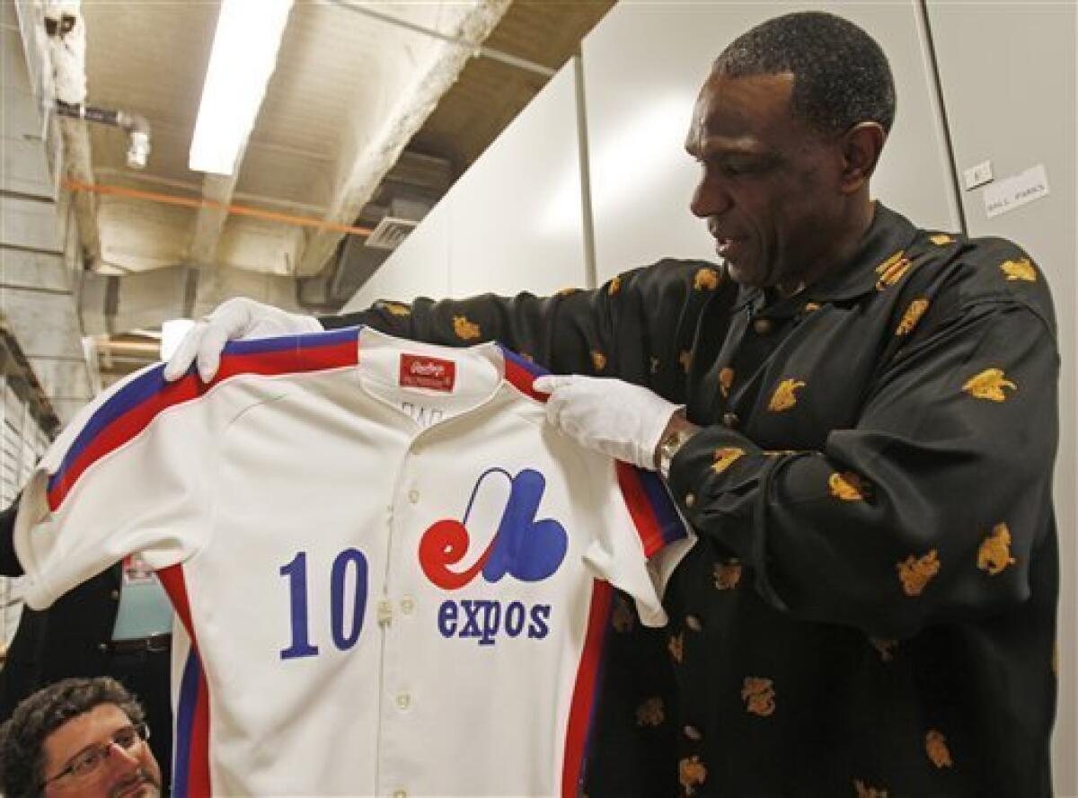 Clerk Haley Hottensee arranges a Andre Dawson jersey at the Safe at Home  store in Cooperstown, New York on July 22, 2010. Montreal Expos and Chicago  Cubs Andre Dawson will be inducted