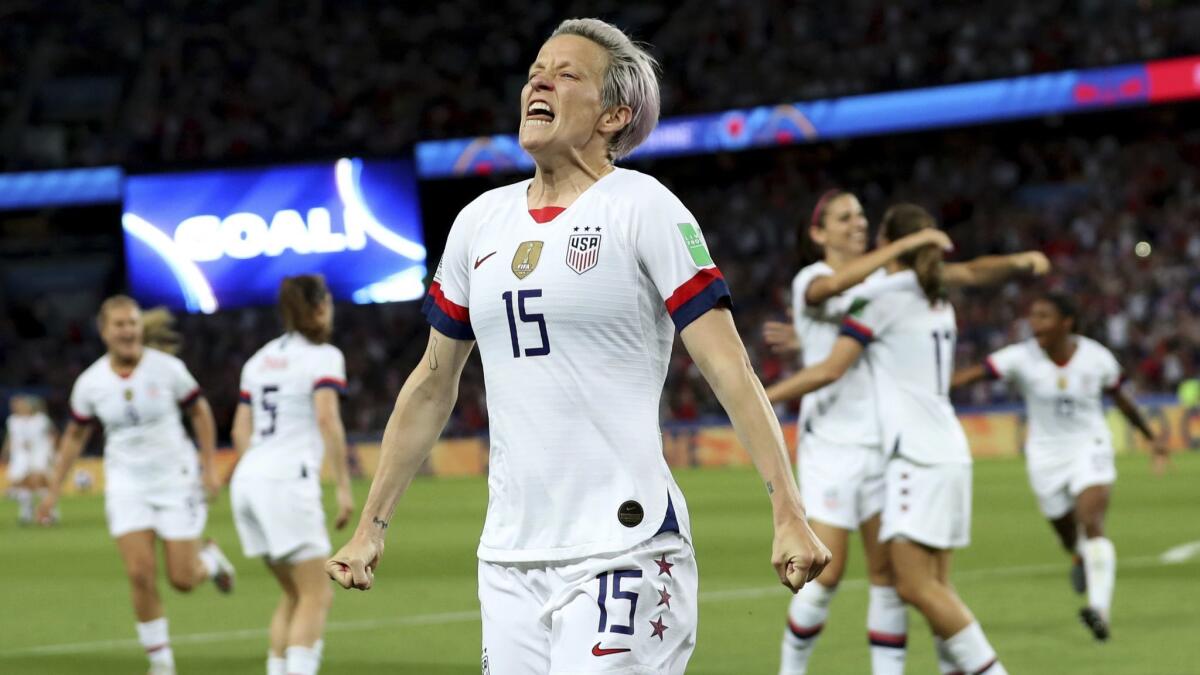 Megan Rapinoe celebrates with her U.S. teammates after scoring a second goal against France in a Women's World Cup quarterfinal match on Friday.
