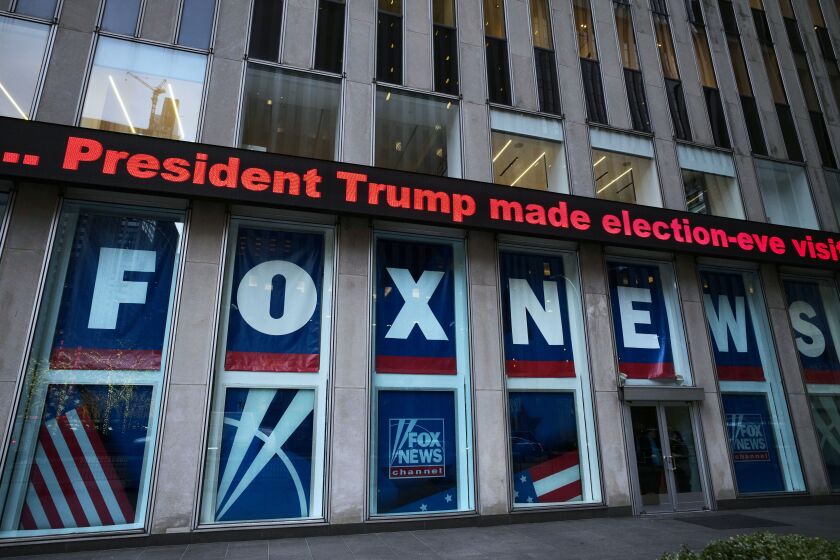 FILE - A headline about President Donald Trump is displayed outside Fox News studios in New York on Nov. 28, 2018. Documents in defamation lawsuit illustrate pressures faced by Fox News journalists in the weeks after the 2020 presidential election. The network was on a collision course between giving its conservative audience what it wanted and reporting uncomfortable truths about then-President Donald Trump and his false fraud claims. (AP Photo/Mark Lennihan, File)