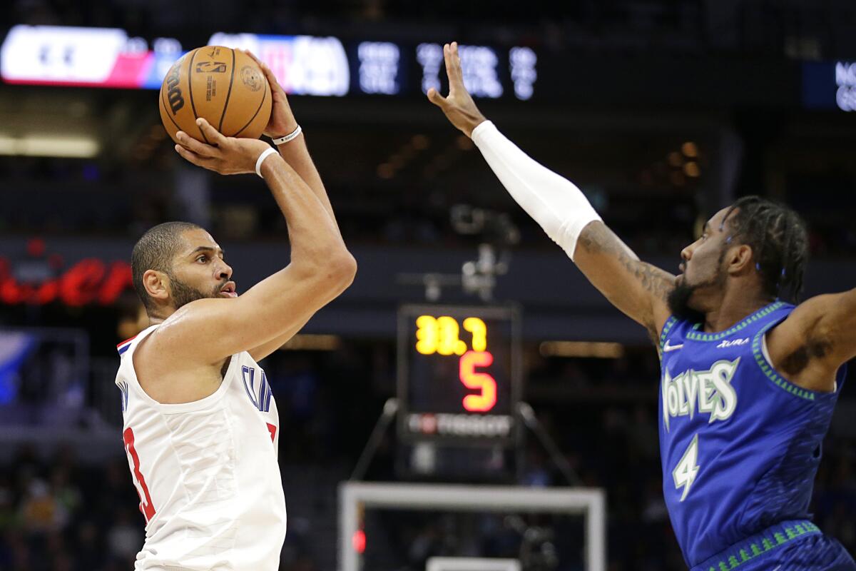 The Clippers' Nicolas Batum goes up for a shot against the Timberwolves' Jaylen Nowell on Nov. 5, 2021.