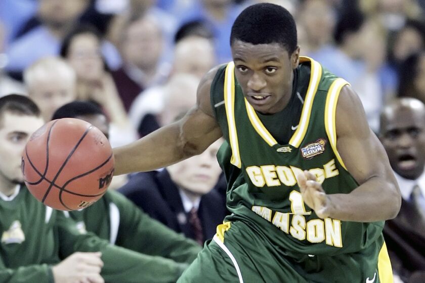 FILE - George Mason's Tony Skinn plays during the Final Four semifinal basketball game against Florida in Indianapolis, Saturday, April 1, 2006. Skinn, who helped lead 11th-seeded George Mason to the Final Four during March Madness as a player in 2006, was hired Thursday, March 30, 2023, to coach men's basketball at the school. (AP Photos/Mark Humphrey, File)