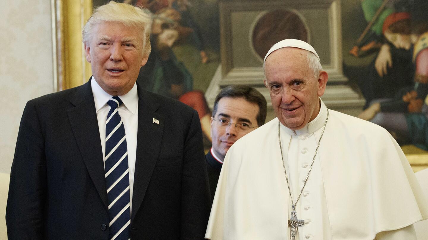 President Donald Trump stands with Pope Francis during a meeting, on May 24, 2017, at the Vatican.