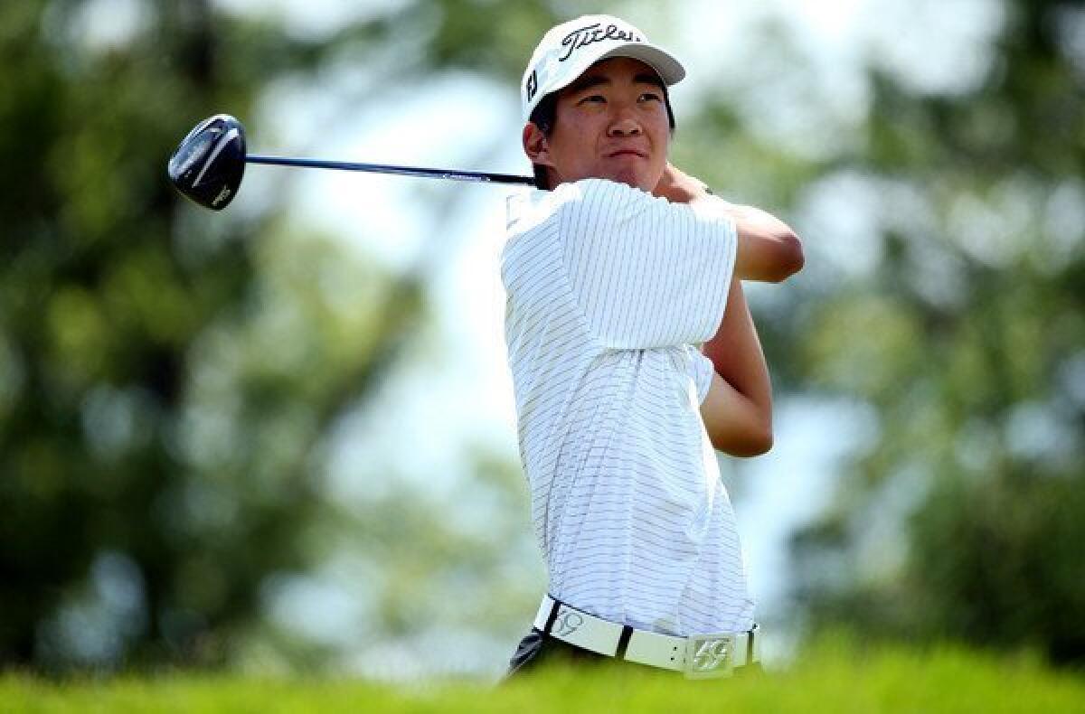 Michael Kim watches his tee shot at No. 4 on Saturday during the third round of the U.S. Open at Merion Golf Club.