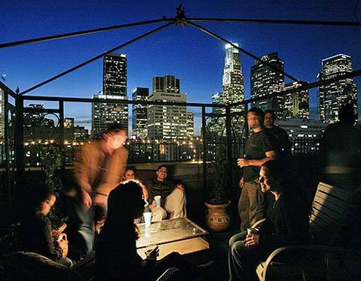 As downtown Los Angeles continues its renaissance, rooftops are emerging as a city above the city, a place where the new homesteaders meet, swim, shoot hoops and otherwise find a sense of community. Residents of the Spring Street Towers gather for a party with the skyline as their backdrop.