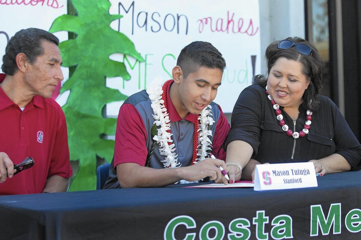 Costa Mesa High volleyball standout Mason Tufuga, center, signs his letter of intent to play for Stanford University.