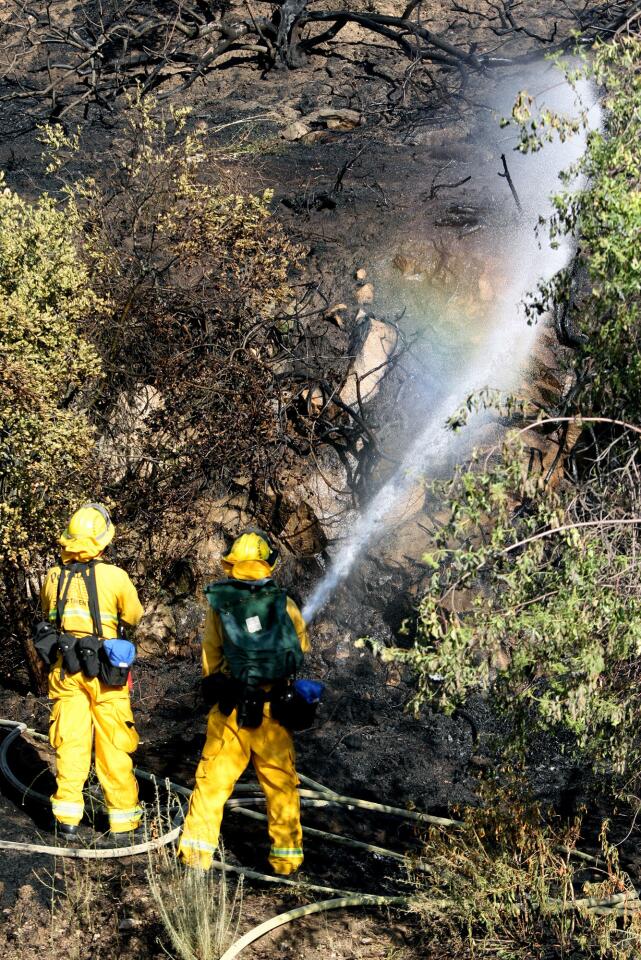 Photo Gallery: Brush fire mop up on Figueroa Street and Linda Vista Road