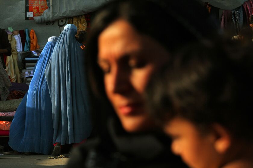 KABUL, AFGHANISTAN-August 13, 2009-Life for the women of Afghanistan changed dramatically in the years after the fall of the Taliban in 2001. Women and girls were allowed to leave their homes without a male escort, attend school, and find employment. Some still preferred to wear a burqa. (Carolyn Cole / Los Angeles Times)
