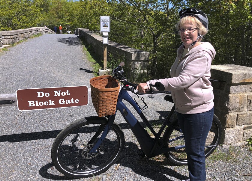 Janice Goodwin and an electric bicycle at Acadia National Park