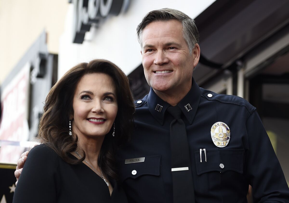 Lynda Carter, left, poses with former Los Angeles Police Department Capt. Cory Palka