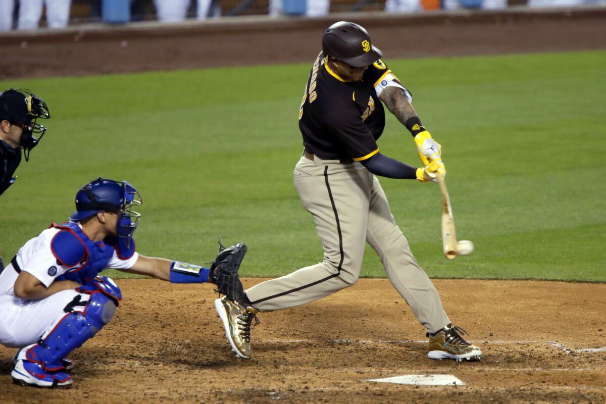 San Diego Padres' Manny Machado hits single