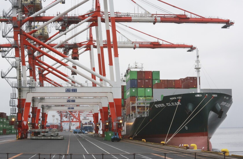 FILE - A container ship is docked at a port in Tokyo, Tuesday, Oct. 12, 2021. Japan has reported Thursday, Dec. 16, 2021, that its exports jumped 20% and imports rose at an even faster pace in November as disruptions to manufacturing supply chains began to ease. (AP Photo/Koji Sasahara, File)