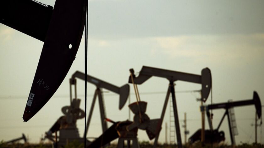Pumpjacks draw oil from wells near Lovington, N.M., on the edge of the Permian Basin in 2015.