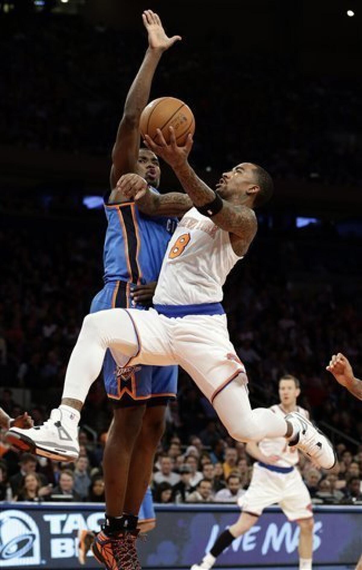 New York Knicks J.R. Smith reacts after making a basket in the