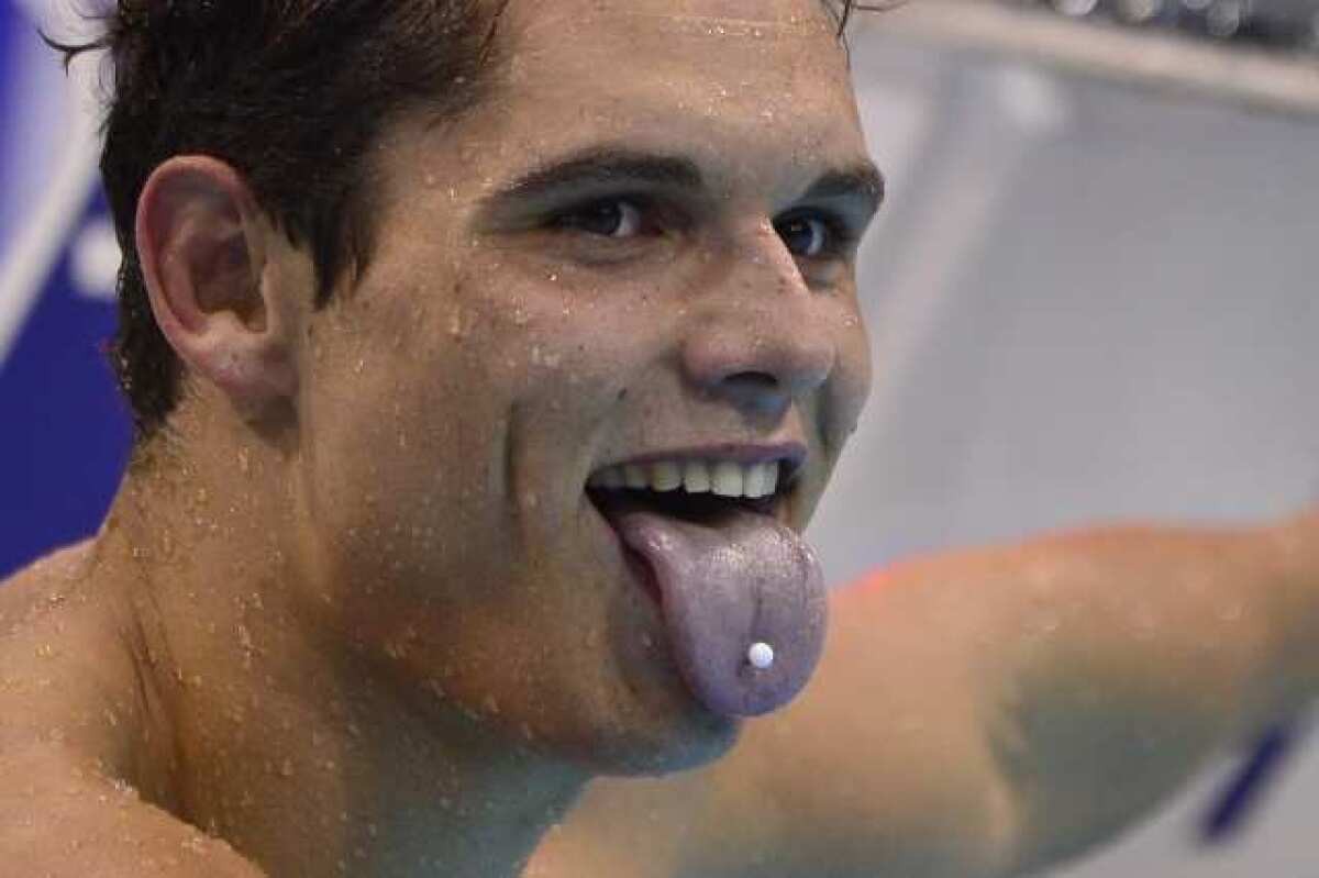 France's Florent Manaudou sticks his tongue out after winning the gold medal in the men's 50-meter freestyle.