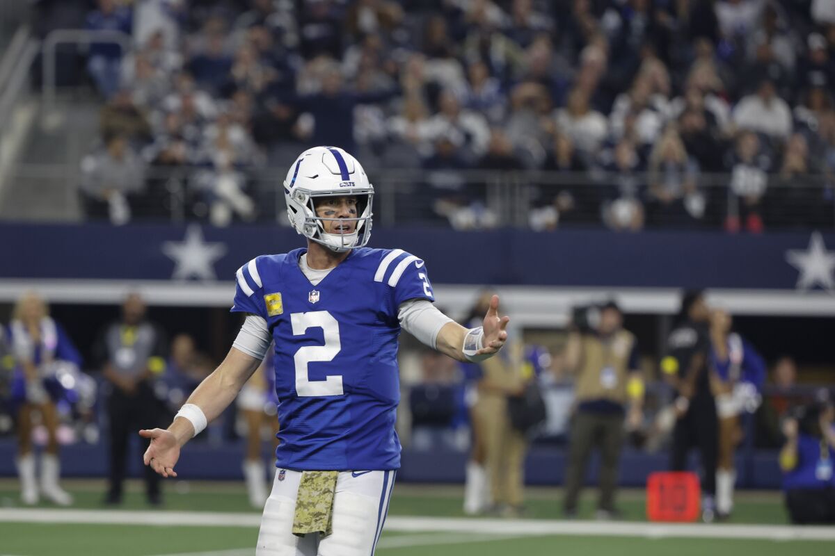 Indianapolis Colts quarterback Matt Ryan (2) reacts during the second half of an NFL football game against the Dallas Cowboys, Sunday, Dec. 4, 2022, in Arlington, Texas. (AP Photo/Michael Ainsworth)