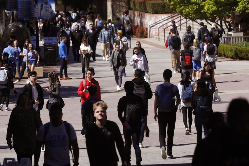 LOS ANGELES, CA - MARCH 13, 2019 ? UCLA students make their way through the UCLA campus a day after the college bribery scandal in Los Angeles on March 13, 2019. A UCLA men's soccer coach was put on leave for being involved. (Genaro Molina/Los Angeles Times)
