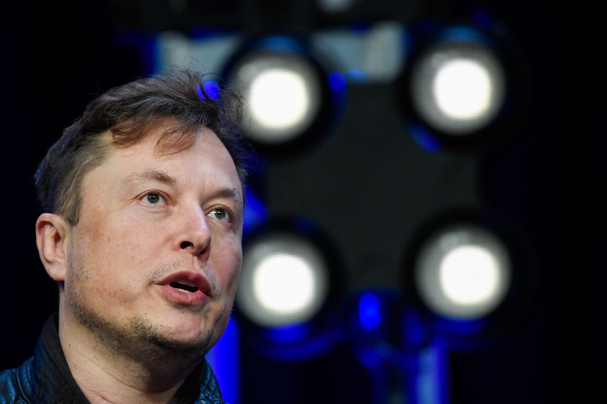 Elon Musk speaks at a conference