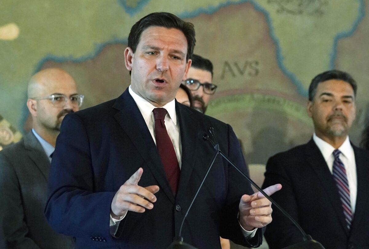 FILE - Florida Gov. Ron DeSantis speaks at Miami's Freedom Tower, on May 9, 2022. The Special Olympics has dropped a coronavirus vaccine mandate for its games in Orlando after Florida moved to fine the organization $27.5 million for violating a state law against such rules. DeSantis, on Friday, June 3, 2022, announced that the organization had removed the requirement for its competition in the state, which is scheduled to run June 5 to June 12. (AP Photo/Marta Lavandier, File)