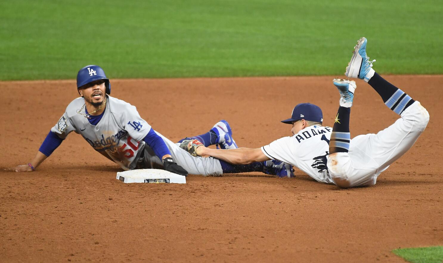 Los Angeles Dodgers' Mookie Betts steals second past Tampa Bay Rays  shortstop Willy Adames during the sixth inning in Game 3 of the baseball World  Series Friday, Oct. 23, 2020, in Arlington