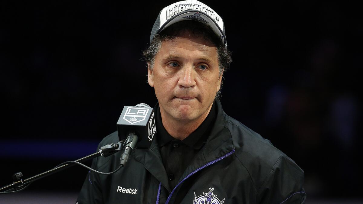 Kings General Manager Dean Lombardi speaks during the team's Stanley Cup championship rally at Staples Center in June.