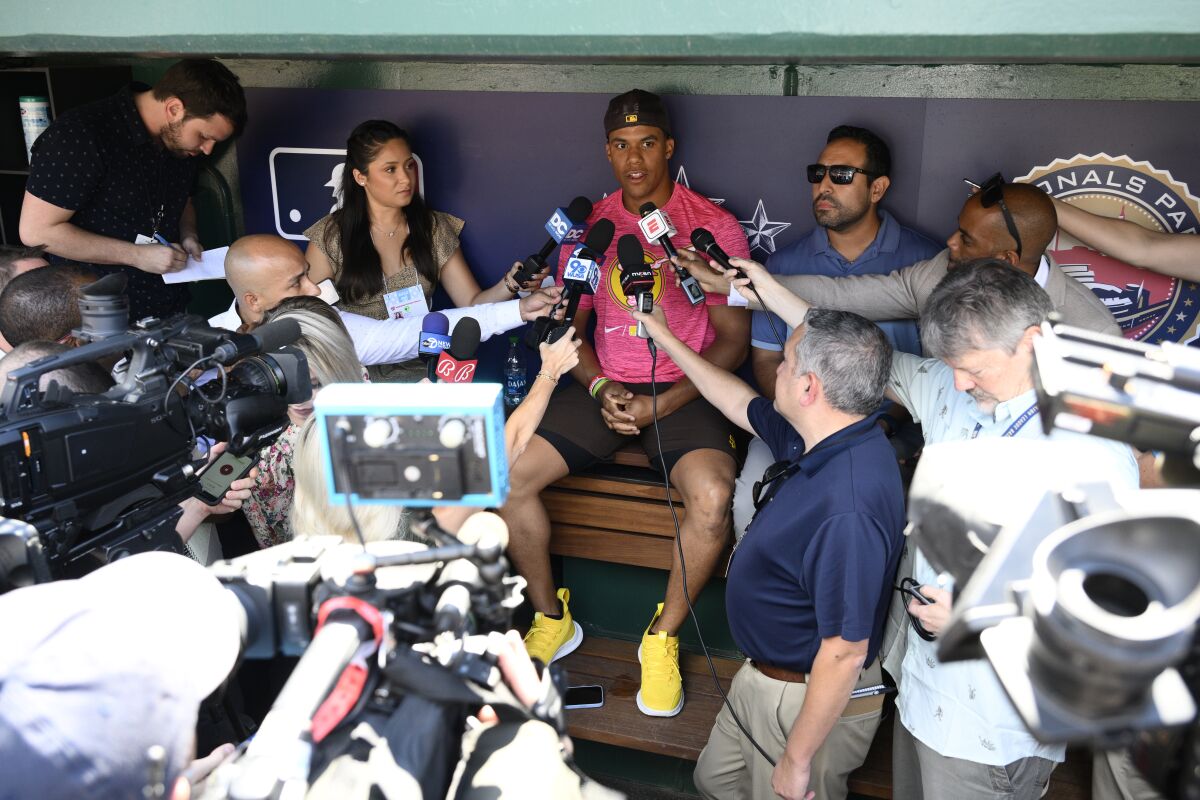 The Padres' Juan Soto talks to the media 