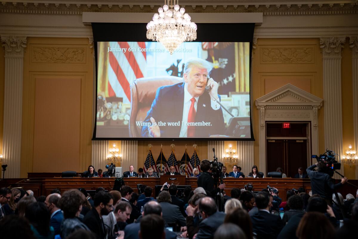 Lawmakers convene as an image of former President Trump is projected on a screen