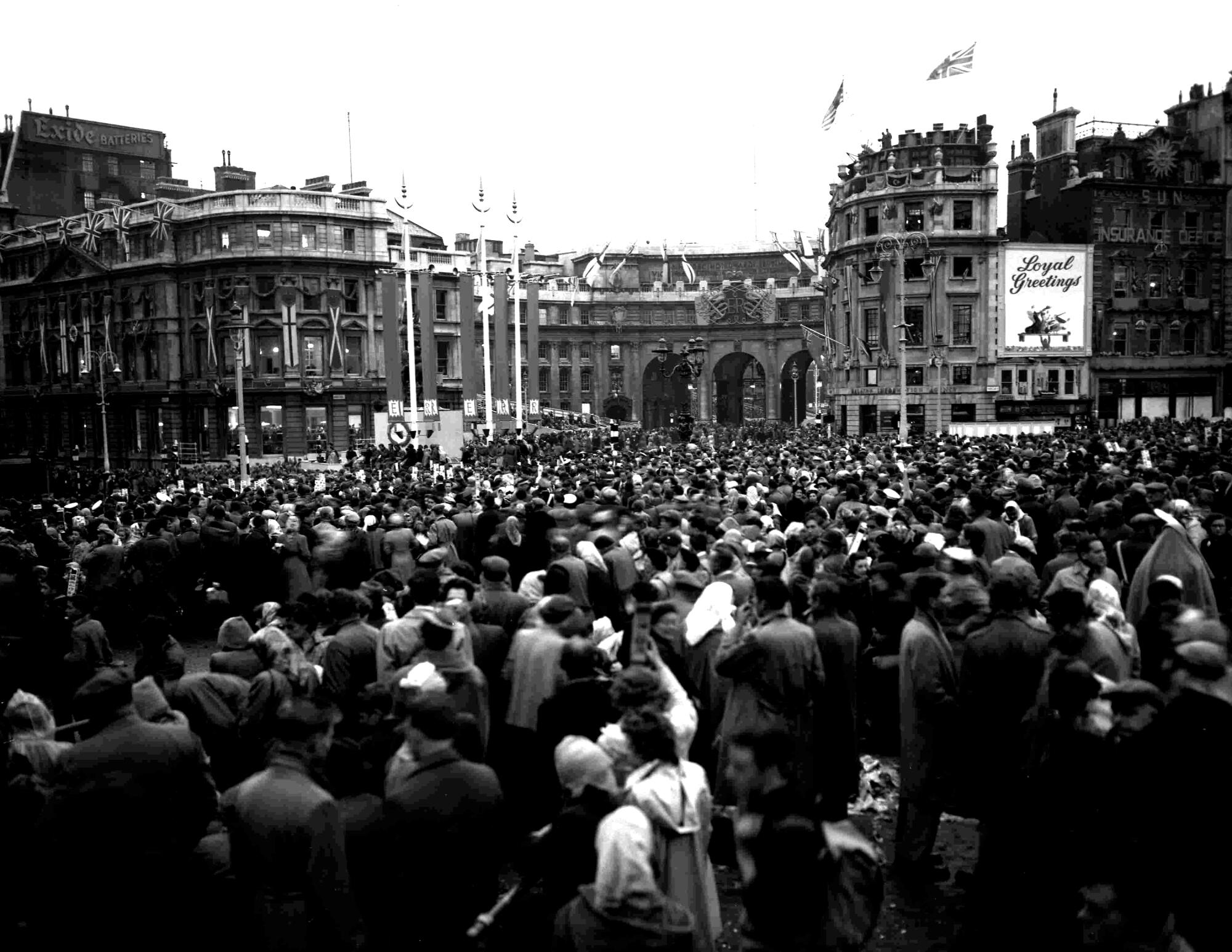 Crowds gather near buildings