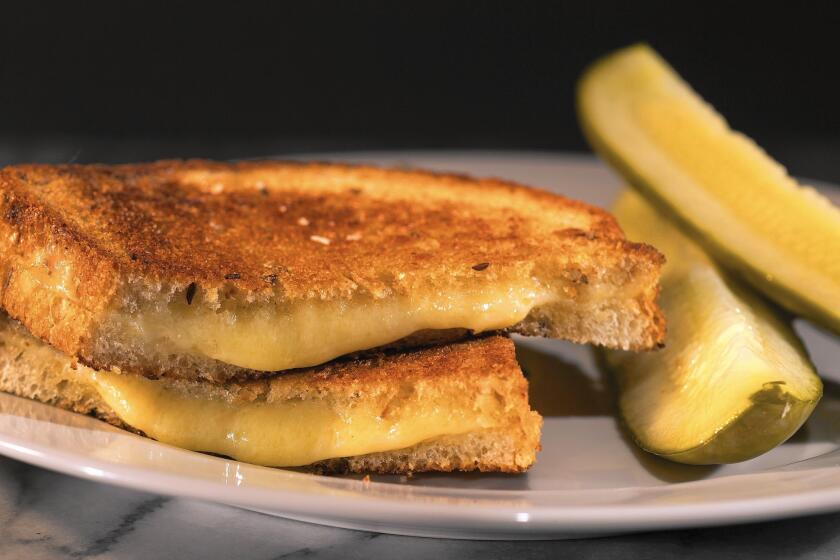 Grilled cheese with Gruyere on rye, served with garlic pickles and French mustard, makes a nice pairing with a Syrah.