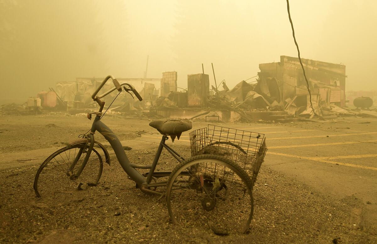 Trike near the remains of a building destroyed by Oregon wildfire