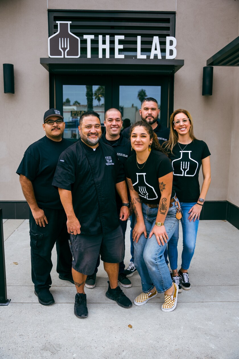 The Lab Collaborative team in front of the Oceanside building