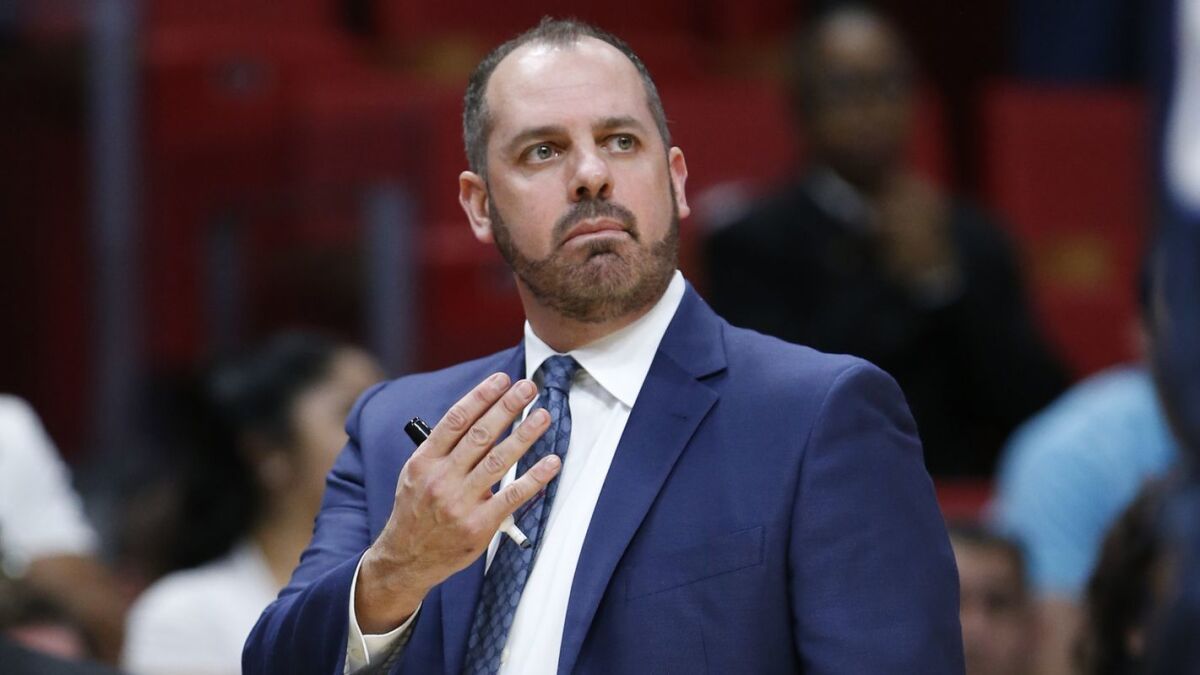 Frank Vogel gestures as he walks the sideline during the second half of a game between the Orlando Magic and Miami Heat on Feb. 5, 2018, in Miami.