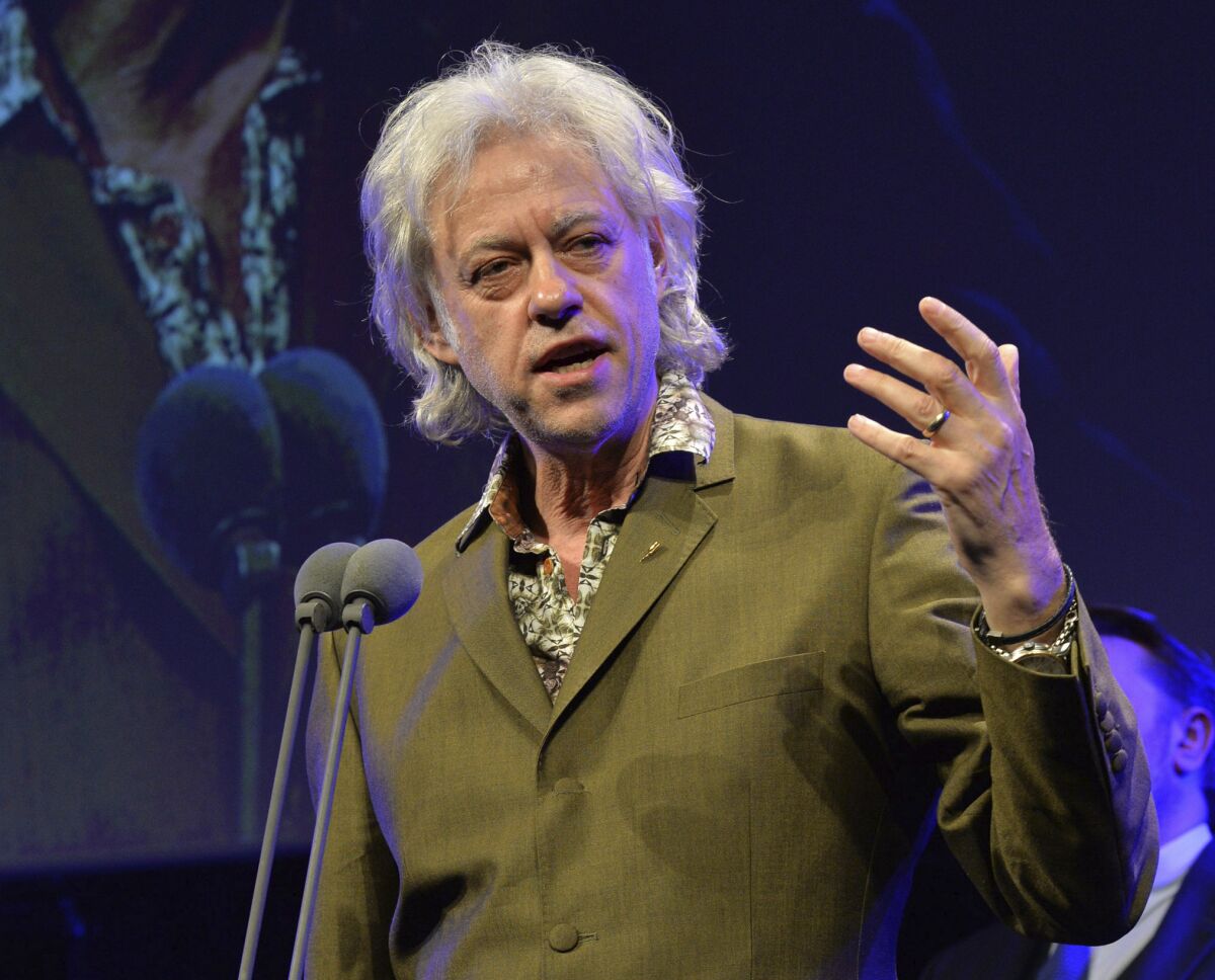FILE - In this May 21, 2015 file photo, Bob Geldof appears at the 60th Ivor Novello Awards in London. Geldof's Live Aid concerts have raised millions. Those shows included performances by Queen, U2, Led Zeppelin and Madonna. He has hosted Live 8 concerts and convinced industrialized nations to pledge an increase in aid to Africa by $25 billion. (Photo by Mark Allan /Invision/AP, File)