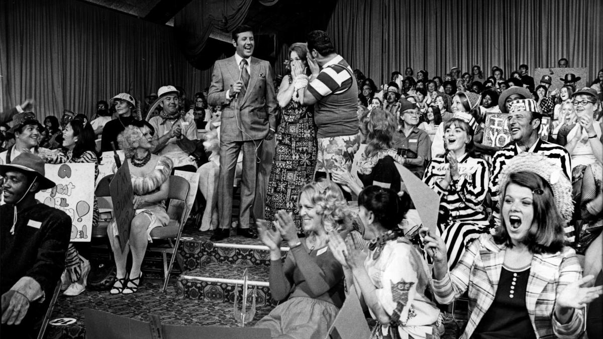 Aug. 1, 1973: Host Monte Hall with two contestants during taping of the television show "Let's Make a Deal."