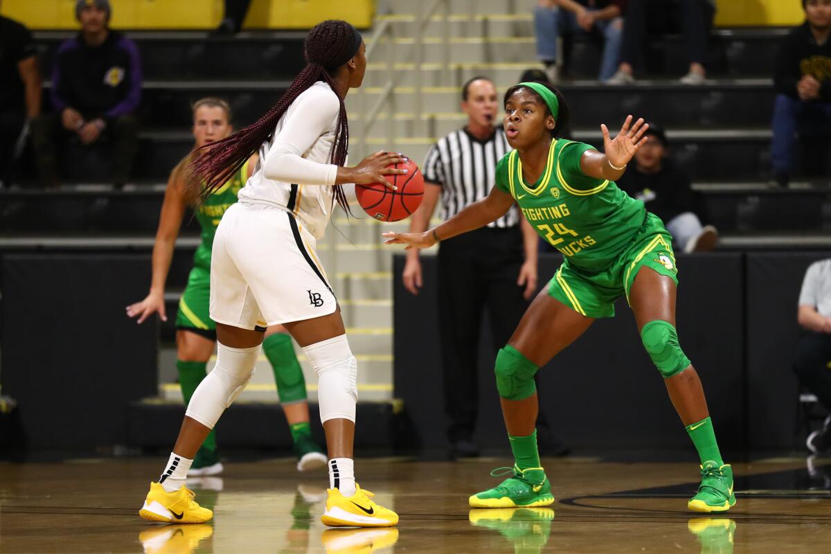 Oregon's Ruthy Hebard, right, guards Long Beach State's Jasmine Hardy during a Dec. 14 game.