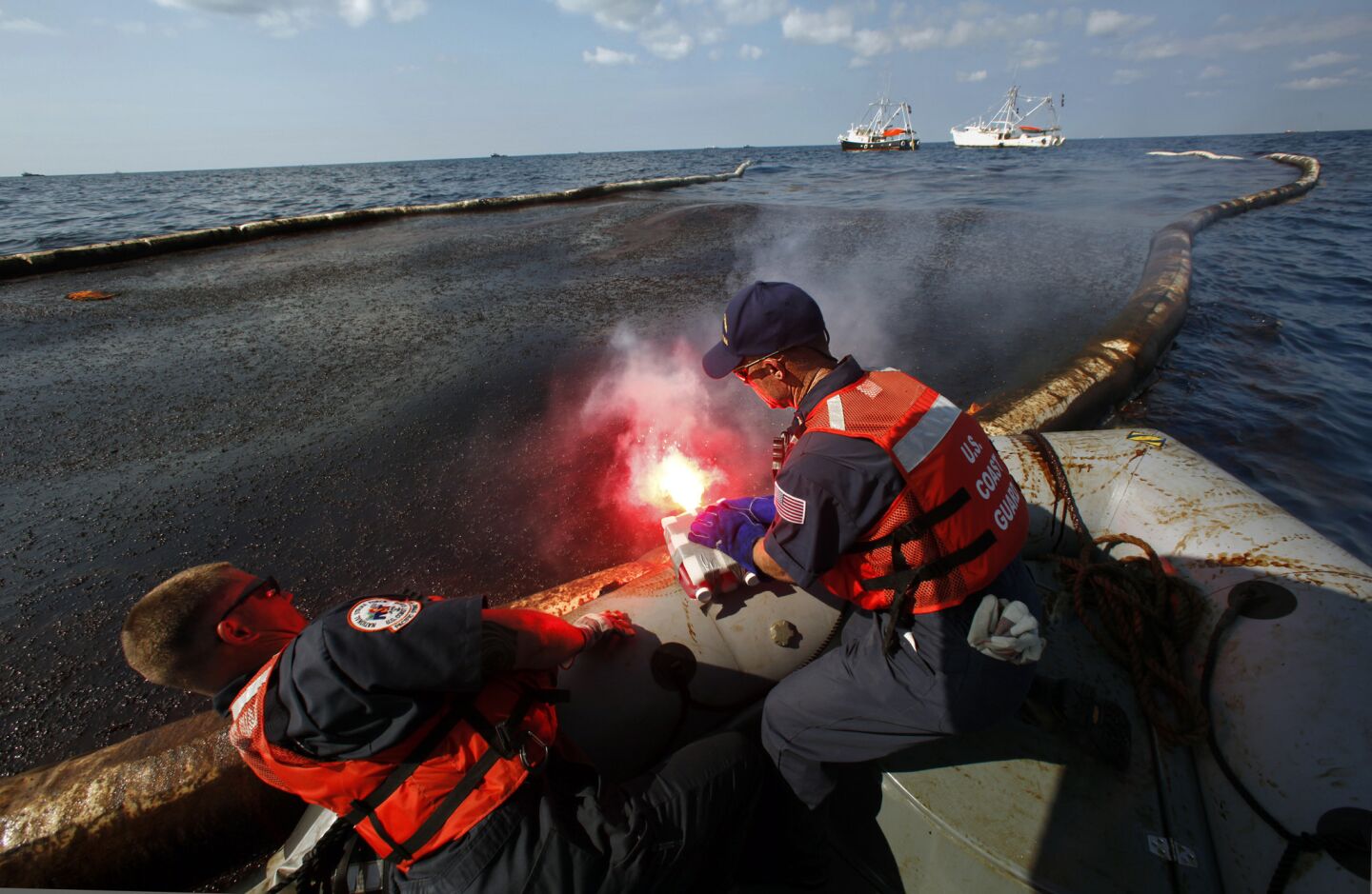 In July 2010, a Coast Guard team ignites oil collected on the surface of the water about 7 miles north of the spill site. Burning was just one of several ways to try to dispose of the oil, which continued to spill into the Gulf of Mexico.