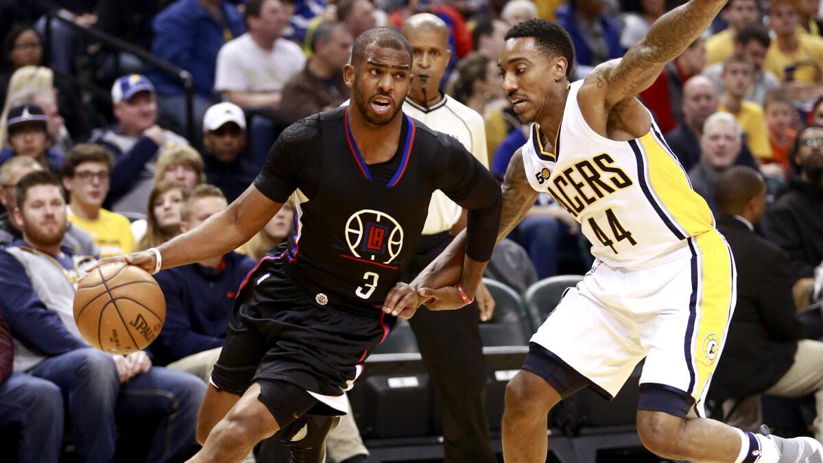 Clippers point guard Chris Paul drives past Pacers point guard Jeff Teague during the first half Sunday.