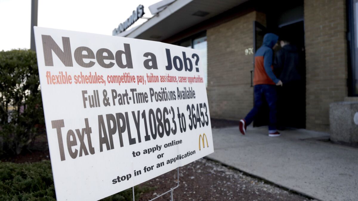 A sign in front of a McDonald's restaurant in Atlantic Highlands, N.J., advertises job openings.