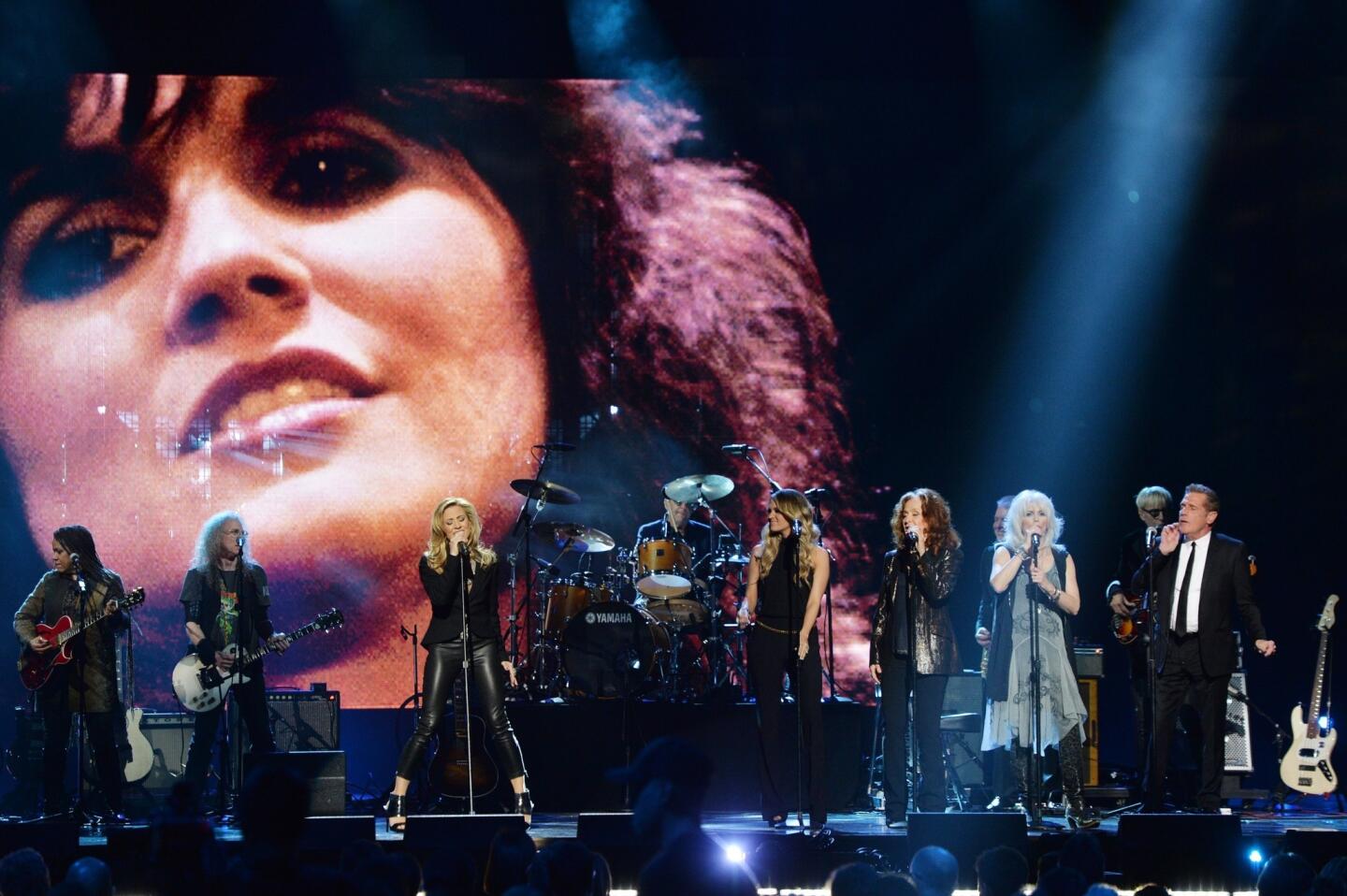 Carrie Underwood, third from left, Sheryl Crow, Bonnie Raitt, Emmylou Harris and Glenn Frey perform.