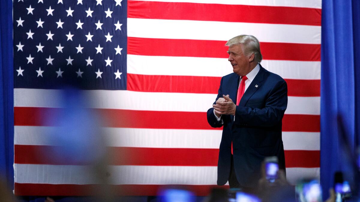 Donald Trump arrives at a town hall Wednesday in Daytona Beach, Fla.