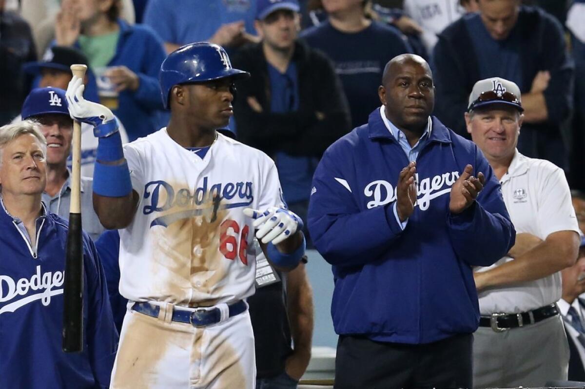 You will probably be seeing more of Magic Johnson at Dodger Stadium from here on out.