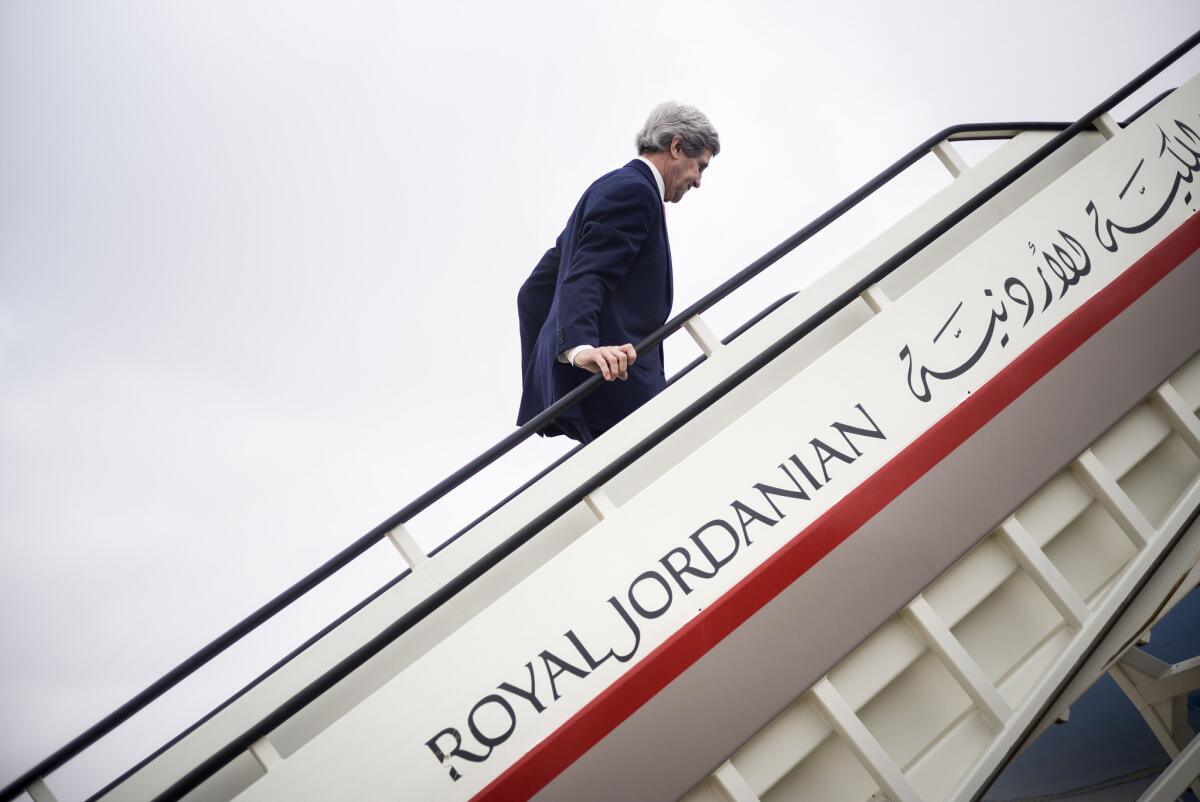U.S. Secretary of State John F. Kerry boards a flight to Saudi Arabia at Queen Alia International Airport in Amman, Jordan, on Sunday.