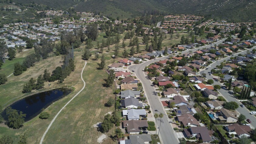 Hundreds of homes line the fairways of the abandoned Escondido Country Club golf course.